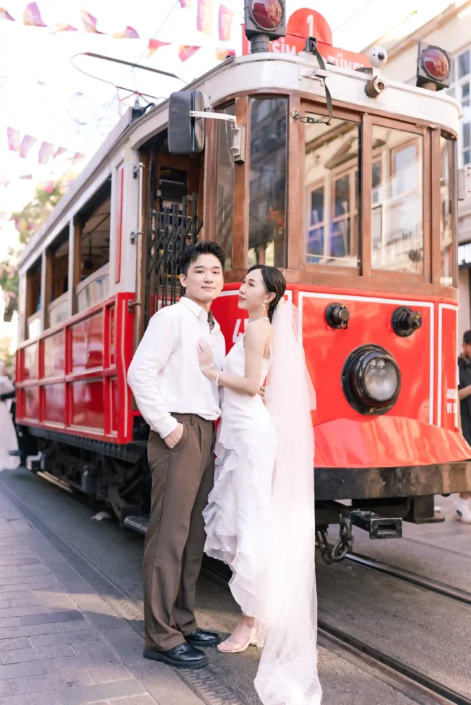 Their wedding photoshoot becomes a celebration of cultural exchange and mutual admiration. Against the backdrop of Istanbul's rich history and vibrant atmosphere, the couple's Korean heritage intertwines with the cosmopolitan energy of the city, creating a harmonious blend of East and West. In the aftermath of the photoshoot, the images serve as cherished memories of a day filled with love, laughter, and shared dreams. Through the lens of the camera, the Red Tram becomes more than just a symbol of Istanbul's past; it becomes a symbol of love's enduring journey, weaving a timeless tale of romance and adventure against the backdrop of the city's enchanting streets.