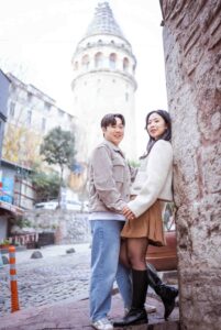 Against the backdrop of the tower's historic architecture, their love story unfolds with an air of timeless romance.